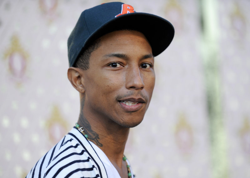 Designer, actor, producer Pharrell Williams arrives at his launch for his new liqueur in the Beverly Hills area of Los Angeles, California July 15, 2011. REUTERS/Gus Ruelas (UNITED STATES - Tags: ENTERTAINMENT HEADSHOT) - RTR2OWAK