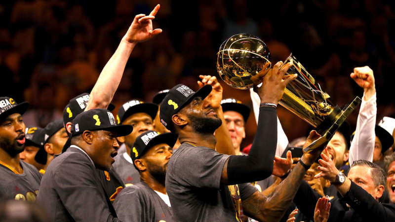 OAKLAND, CA - JUNE 19: LeBron James #23 of the Cleveland Cavaliers holds the Larry O'Brien Championship Trophy after defeating the Golden State Warriors 93-89 in Game 7 of the 2016 NBA Finals at ORACLE Arena on June 19, 2016 in Oakland, California. NOTE TO USER: User expressly acknowledges and agrees that, by downloading and or using this photograph, User is consenting to the terms and conditions of the Getty Images License Agreement. (Photo by Ezra Shaw/Getty Images)